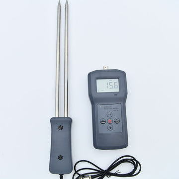 Digital sawdust moisture meter with separate probe and carrying case.